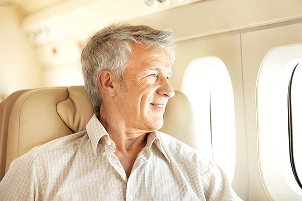 Man Looking Out Plane Window
